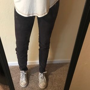 Grey pants with zippers on ankles
